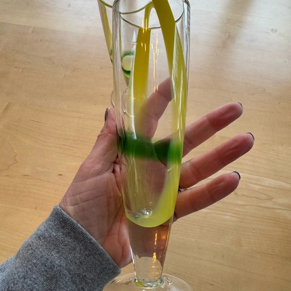 Elegant Glass Champagne Flutes with Yellow and Green Design